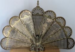 Vintage brass extending Peacock firescreen. Approx. 64 x 96cm