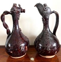 19TH CENTURY PAIR OF INTERESTING TERRACOTTA TREACLE GLAZED ECLESIASTICAL/COMMUNION FLAGONS,