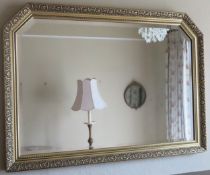 Large gilded and bevelled overmantle mirror. Approx. 72 x 103cm