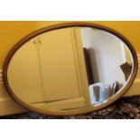 Late 19th/Early 20th century large gilded and bevelled oval wall mirror. Approx. 63 x 95cm