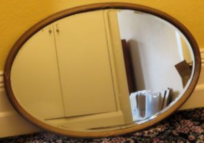 Late 19th/Early 20th century large gilded and bevelled oval wall mirror. Approx. 63 x 95cm