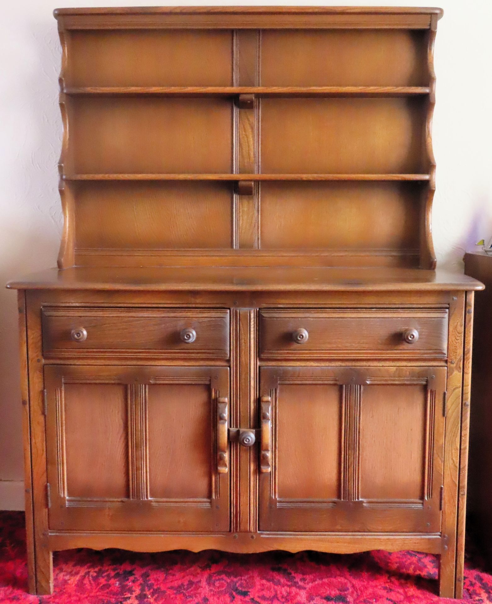 Ercol mid 20th century oak panelled kitchen dresser with plate rack