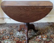 Early 20th century oval mahogany drop leaf table on tripod supports. Approx. 72cm H 117cm W x 87cm D