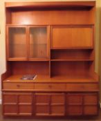 Nathan mid 20th century teak glazed wall unit. Approx. 194 x 175 x 46cms reasonable used with