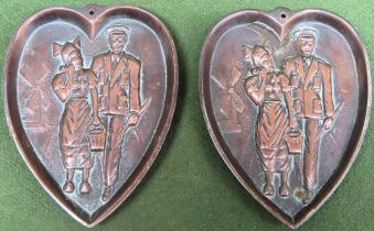 Pair of pretty double sided humorous relief decorated copper heart from small plaques. Approx. 11cms