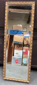 20th century gilded and bevelled rectangular wall mirror. Approx. 127 x 44cms