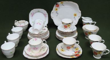 Two Art Deco style floral decorated part tea sets all used and unchecked but mostly appears