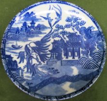 Late 19th/early 20th century Oriental blue and white plaque, decorated with Willow pattern,