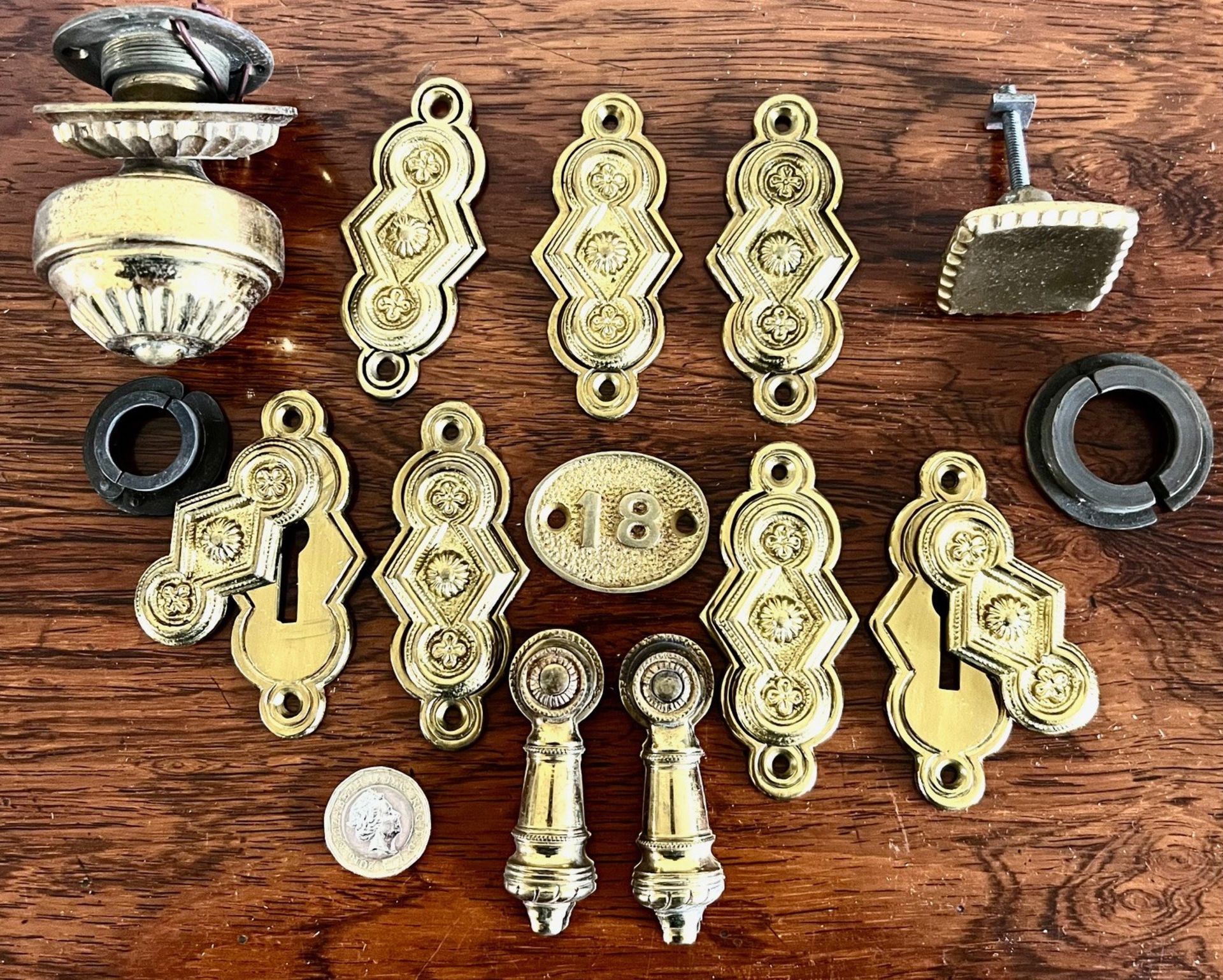 NINE VARIOUS ESCUTCHEONS, TWO BRASS KNOBS, ETC.