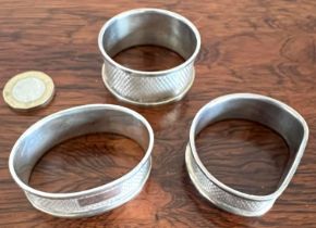 THREE SILVER NAPKIN RINGS