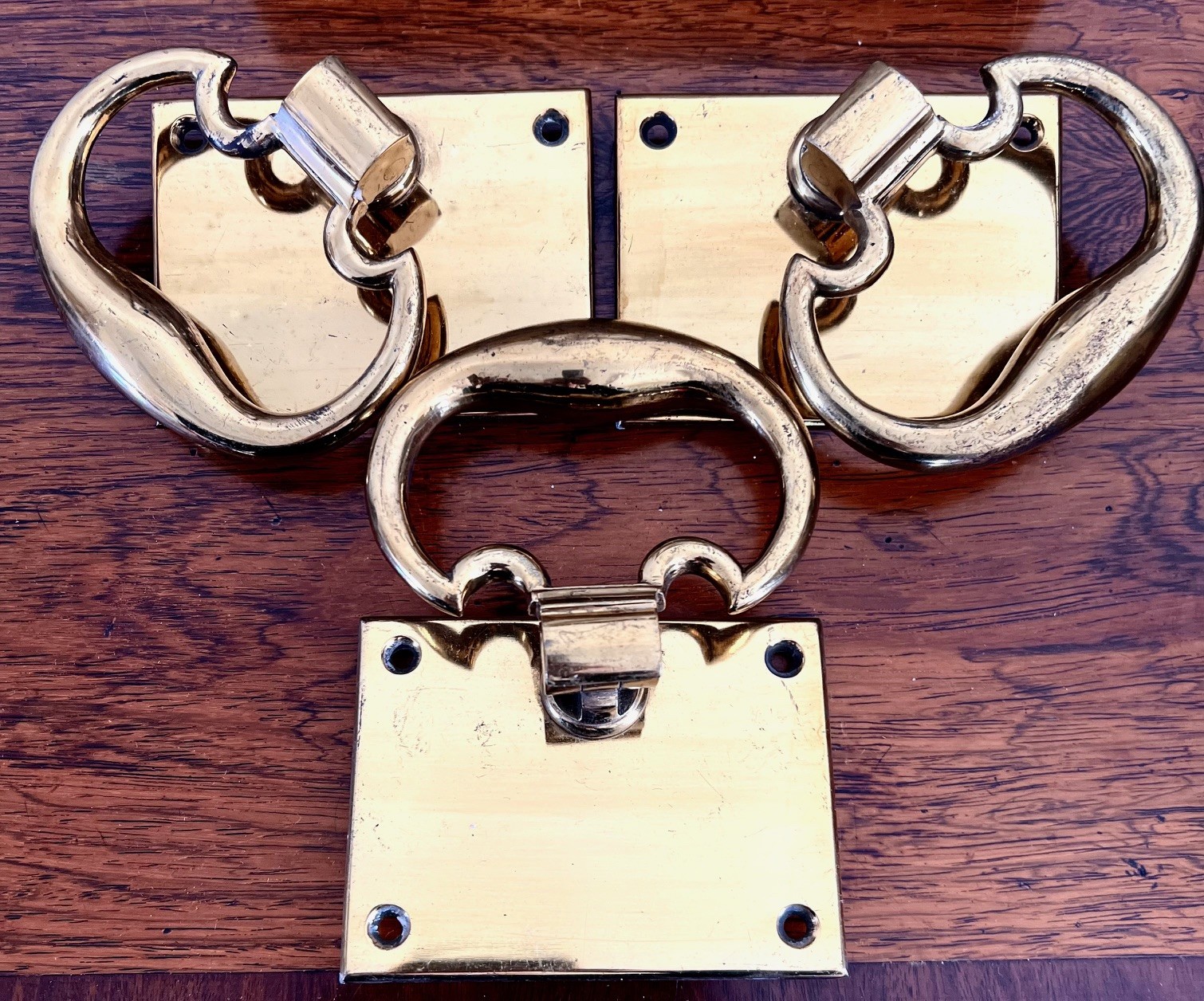 THREE BRASS "TRAP DOOR" HINGE HANDLES UPON BACK PLATES, HEAVY QUALITY, CAN BE ROTATED 360 DEGREES,