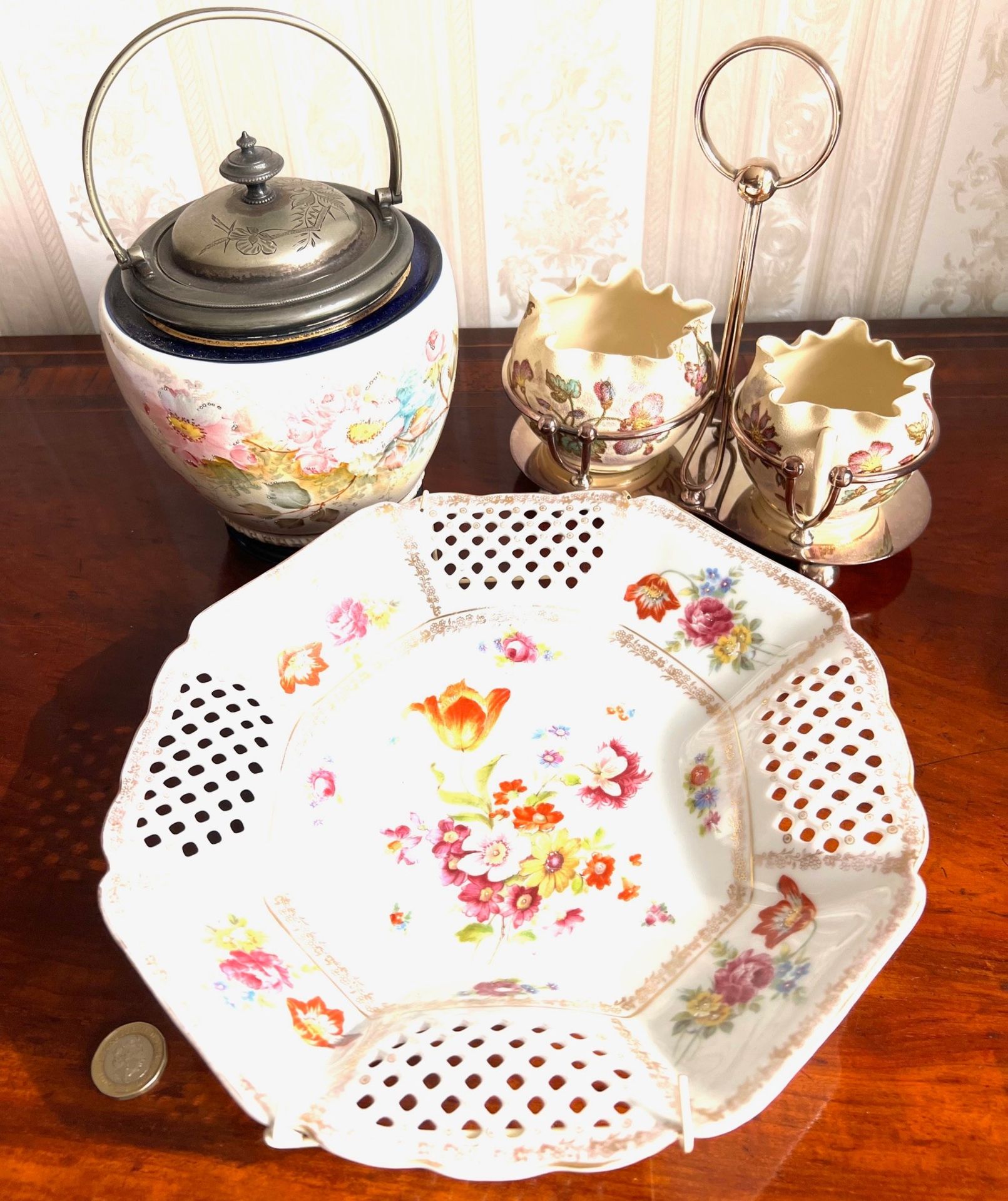 THREE PIECES INCLUDING BISCUIT BARREL, SUGAR AND CREAMER AND PIERCED CERAMIC PLATE