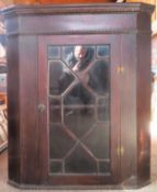 20th century mahogany single door glazed wall mounting corner cabinet. Approx. 104cm H x 90cm W x