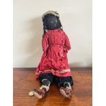 EARLY 20th CENTURY CHARACTER DOLL, PROBABLY ORIGINAL CLOTHING, APPROX 22cm LONG