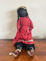 EARLY 20th CENTURY CHARACTER DOLL, PROBABLY ORIGINAL CLOTHING, APPROX 22cm LONG