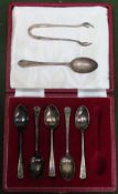 Casd set of 5 hallmarked silver coffee spoons, another silver teaspoon, plus silver sugar tongs.