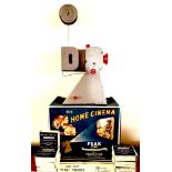 'THE HOME CINEMA' PEAK 16mm PROJECTOR PLUS SEVEN BLACK AND WHITE FILMS, HAND OPERATED