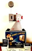 'THE HOME CINEMA' PEAK 16mm PROJECTOR PLUS SEVEN BLACK AND WHITE FILMS, HAND OPERATED