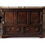 19th century carved fronted oak panelled two drawer sideboard with two cupboard doors. Approx. 92.