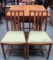 Early 20th century light oak draw leaf dining table, with three Ercol dining chairs. Table Approx.