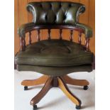 20th century green leather upholstered swivel office armchair. Approx. 82 x 66 x 75cms reasonable