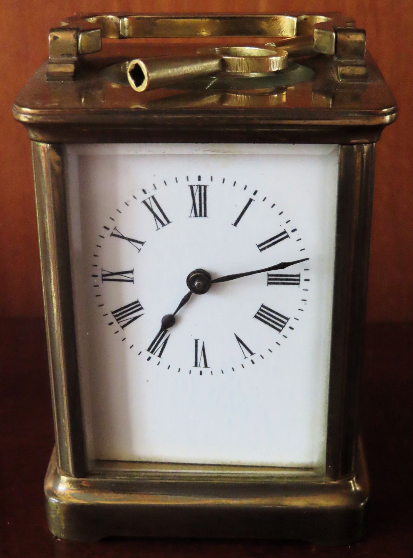 Early 20th century brass and glass carriage clock with enamelled dial. Approx. 11cms H reasonable