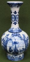 Blue and White glazed ceramic Delft vase, with panels depicting Dutch scenes. Approx. 30cm H Used