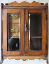 Early 20th century oak two door smokers cabinet with fitted interior. Approx. 45 x 32 x 19cms