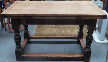 Late 19th/early 20th century carved oak draw leaf refectory dining table, on stretchered supports.