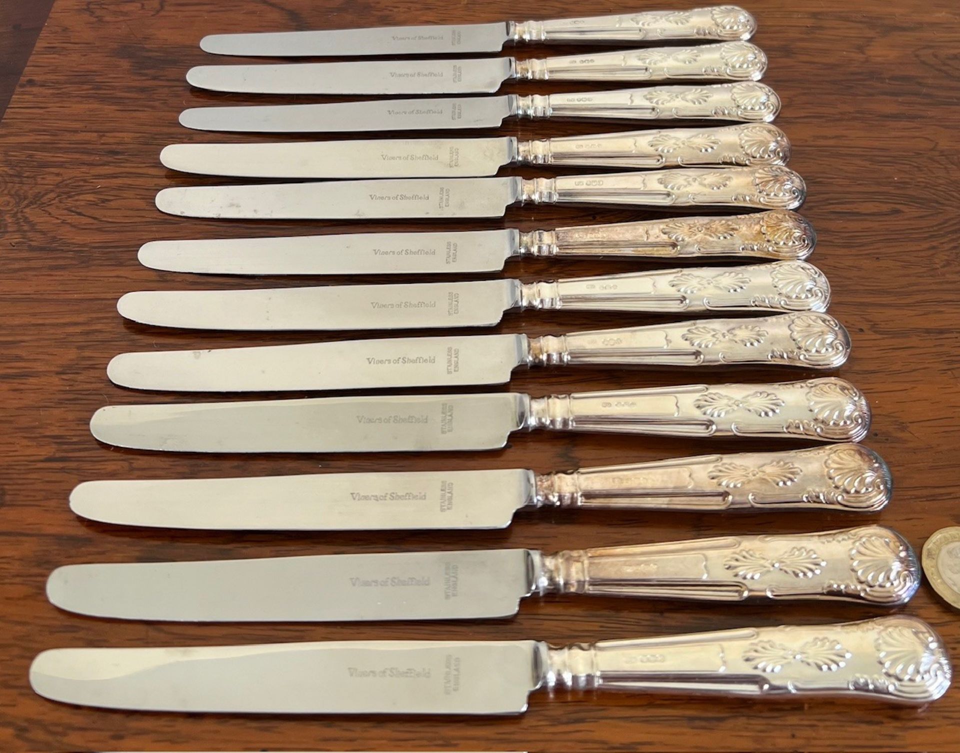 TWELVE VYNERS SECOND-COURSE KNIVES HAVING SILVER HANDLES, SHEFFIELD, 1965