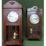 Oak cased wall clock, plus smaller oak cased wall clock Both in used condition, not tested for