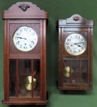 Oak cased wall clock, plus smaller oak cased wall clock Both in used condition, not tested for
