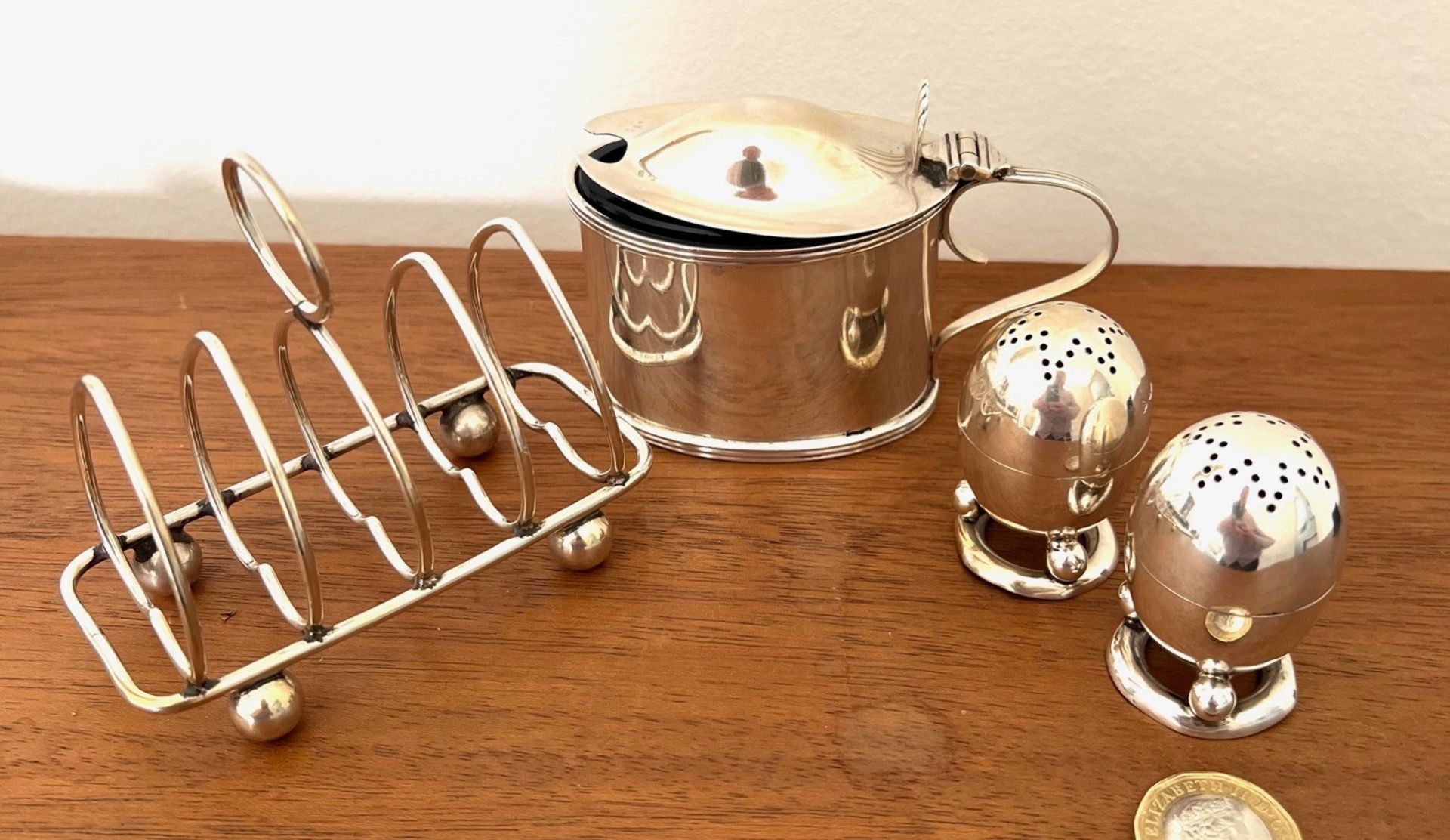 SMALL SILVER TOAST RACK, MUSTARD POT WITH LINER AND TWO PEPPERETTES