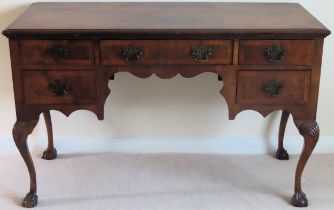 20th century walnut veneered five drawer desk. Approx. 76cm H x 123cm W x 65cm D Used condition,