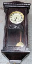 Early 20th century dark wood wall hanging clock. Approx. 80cm