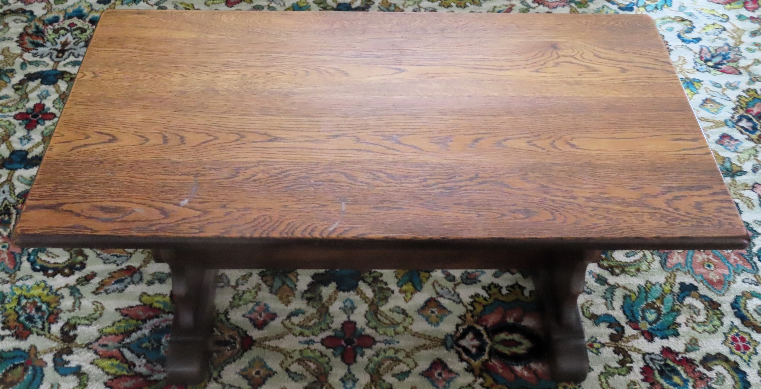 Small oak refectory style coffee table. Approx. 45cm H x 90cm W x 47cm D Reasonable used