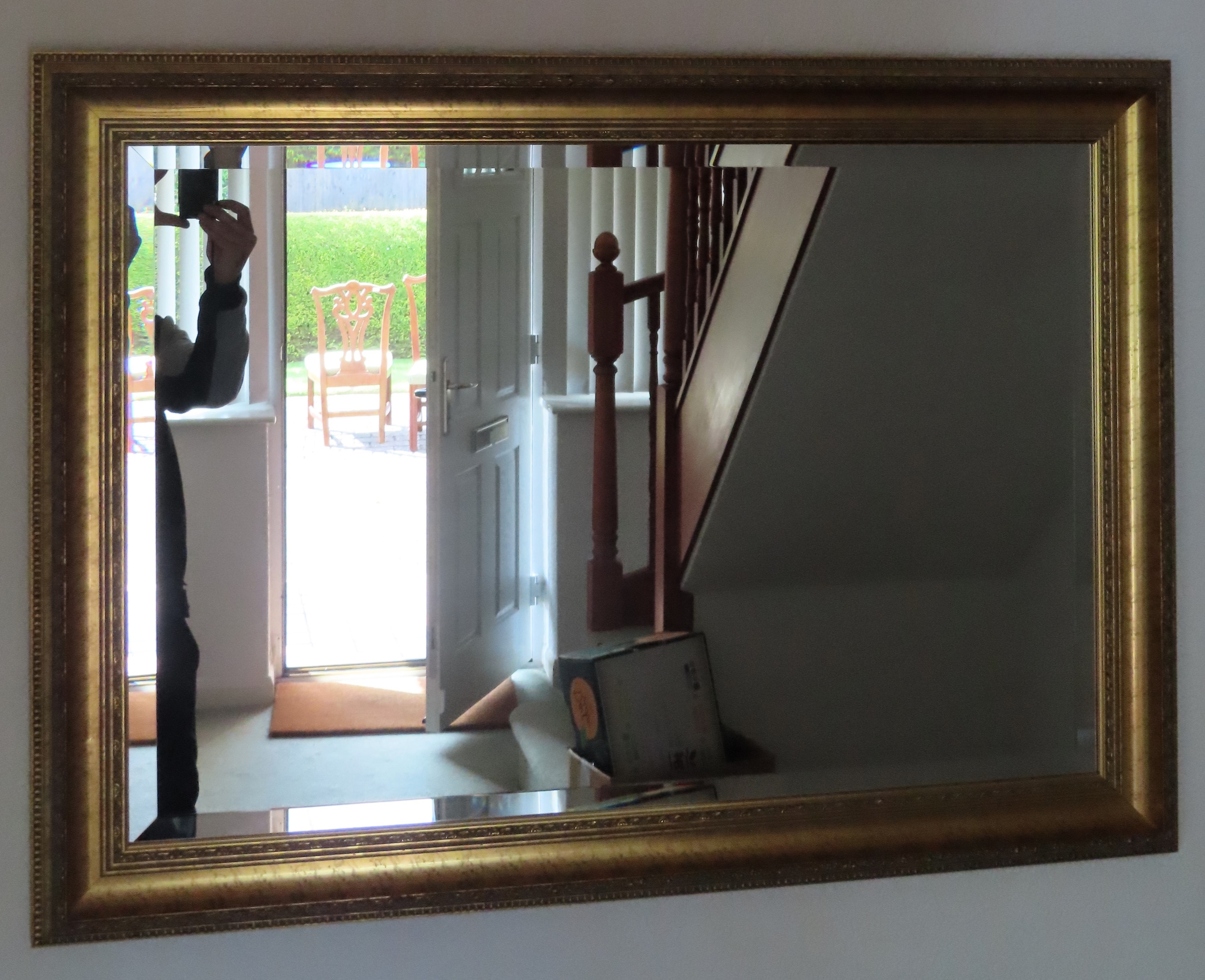 20th century gilded and bevelled wall mirror. Approx. 59 x 87cms reasonable used condition