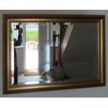 20th century gilded and bevelled wall mirror. Approx. 59 x 87cms reasonable used condition