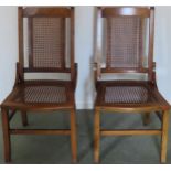 Pair of early 20th century berger seated and backed kitchen chairs. Approx. 86cms H reasonable