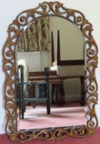 Art Deco bevelled wall mirror with gilded pirecework decoration. Approx. 74 x 51cms reasonable