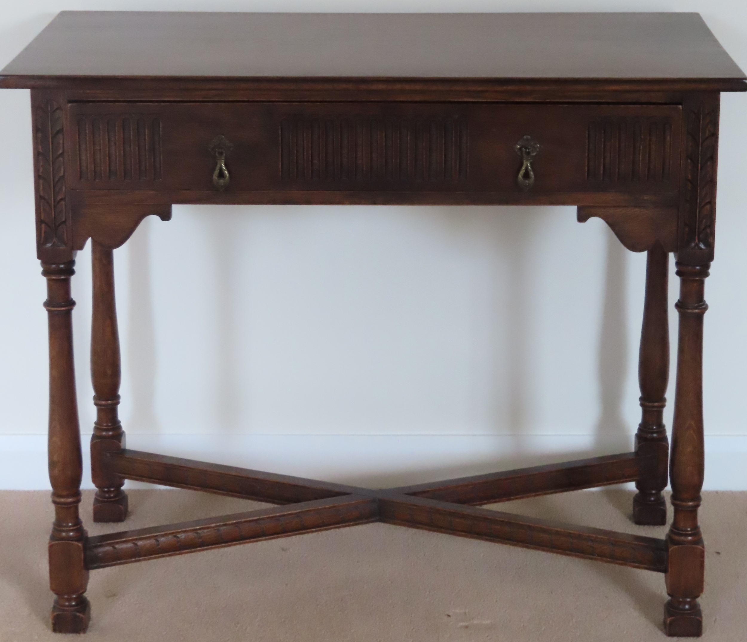 20th century oak priory style single drawer side table on stretchered supports. Approx. 76 x 91 x