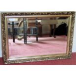 20th century gilded and bevelled wall mirror. Approx. 54 x 76cms reasonable used condition with