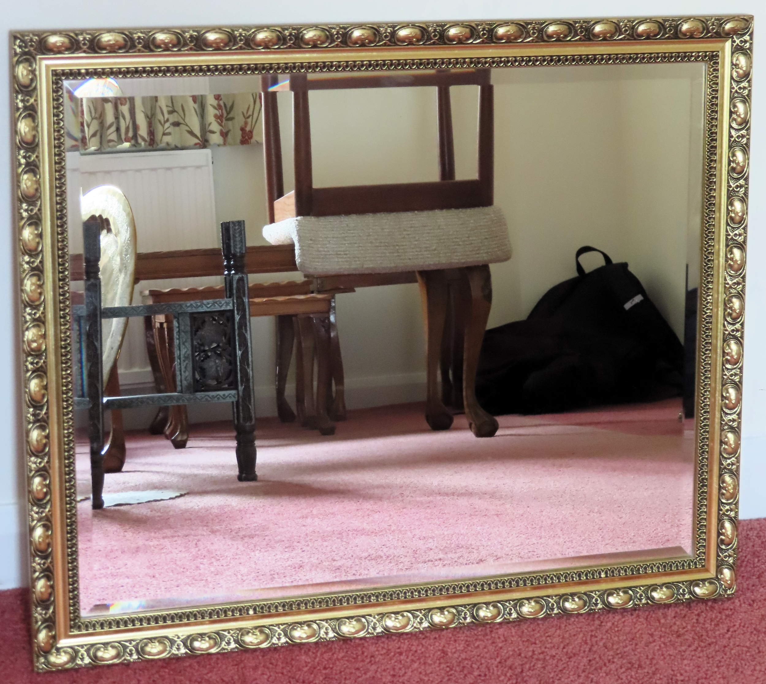 20th century gilded and bevelled wall mirror. Approx. 58 x 63cms reasonable used condition with