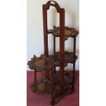 20th century carved five tier folding cake stand. Approx. 76cms H reasonable used condition with