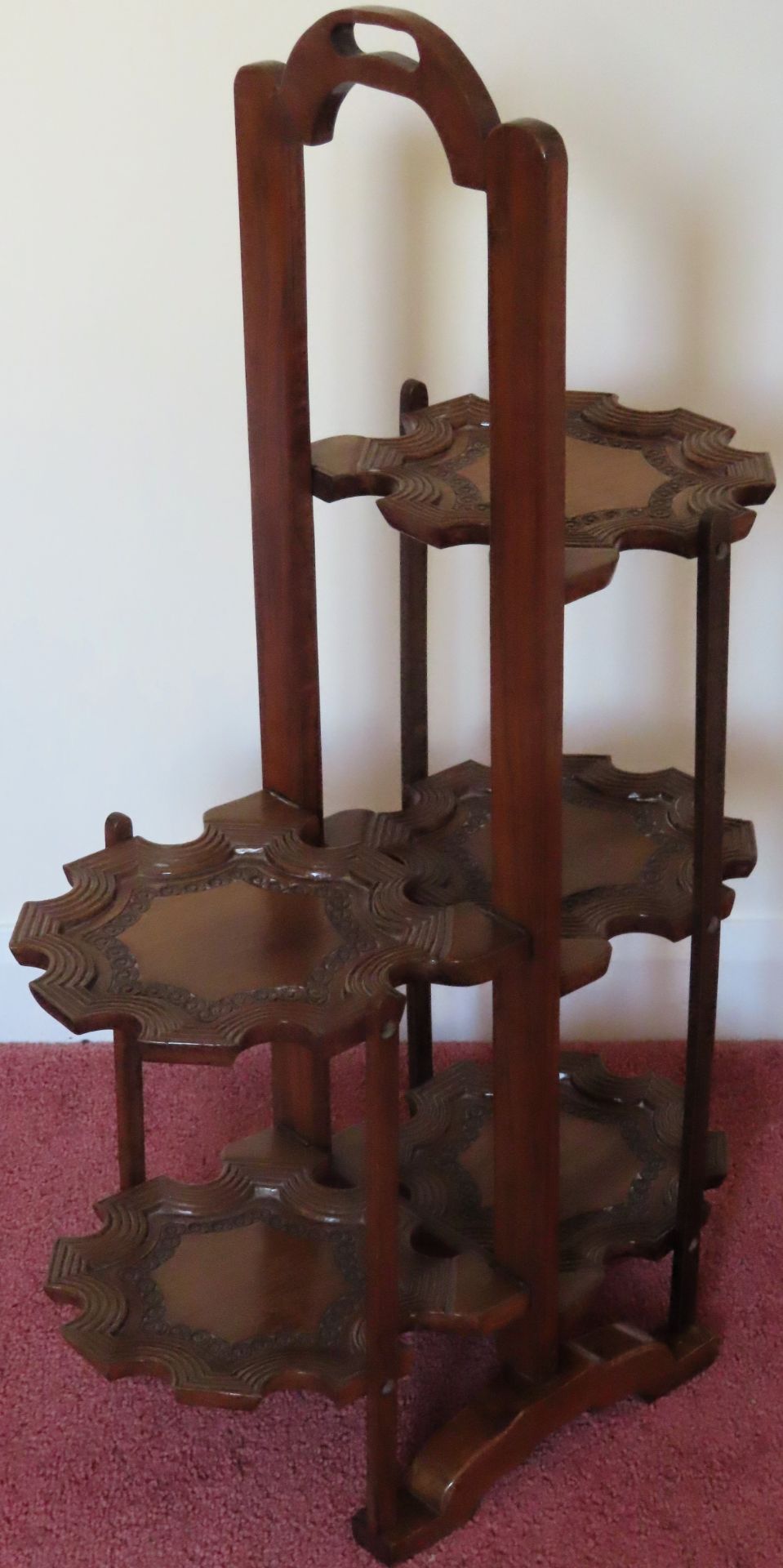 20th century carved five tier folding cake stand. Approx. 76cms H reasonable used condition with