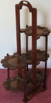 20th century carved five tier folding cake stand. Approx. 76cms H reasonable used condition with