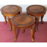Three small 20th century circular carved mahogany pie crust edged tables on ball and claw supports