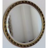 20th century gilded and bevelled circular wall mirror. Approx. 46cms D reasonable used condition