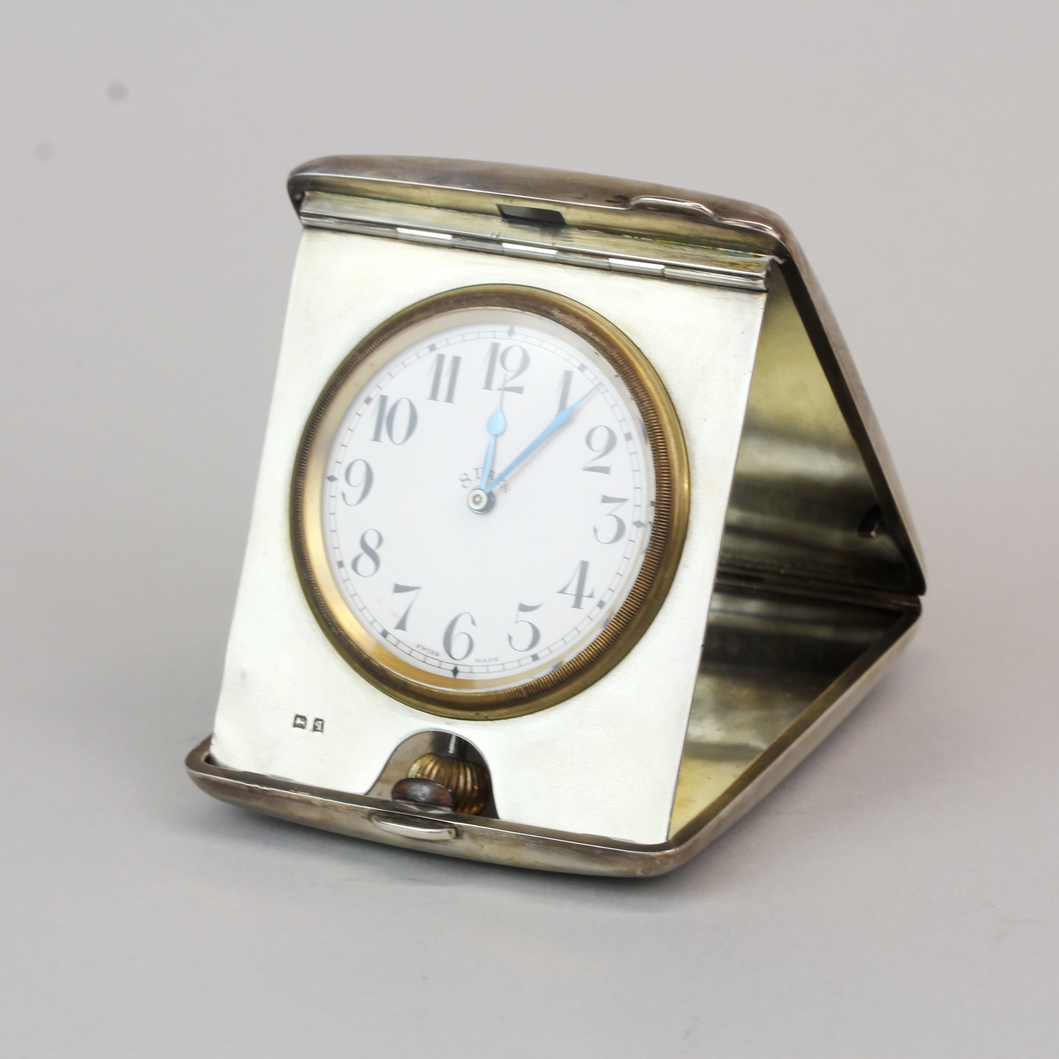 A hallmarked silver cased folding travelling clock by William Neal , Birmingham, c. 1911. 8.5 x 10 x