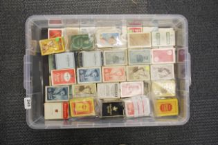 A large collection of vintage packs of playing cards.